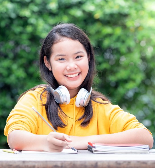 student smiling in the park