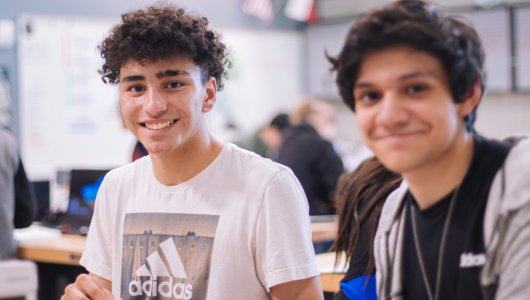 students smiling in class
