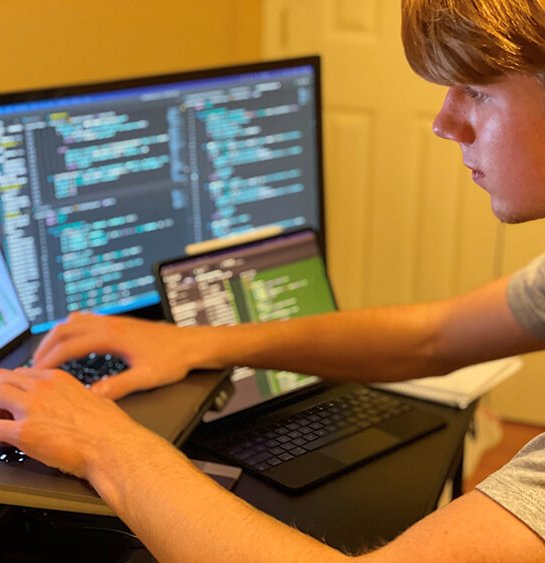 student with computers