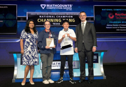 Channing Yang is presented with the 2023 Raytheon Technologies National Champion award by Bindu Nair, the director of basic research at the Office of the Under Secretary of Defense, his coach Andrea Smith, and Tracey Gray, MATHCOUNTS board chair and vice president of Communications and External Affairs for Raytheon Intelligence & Space.